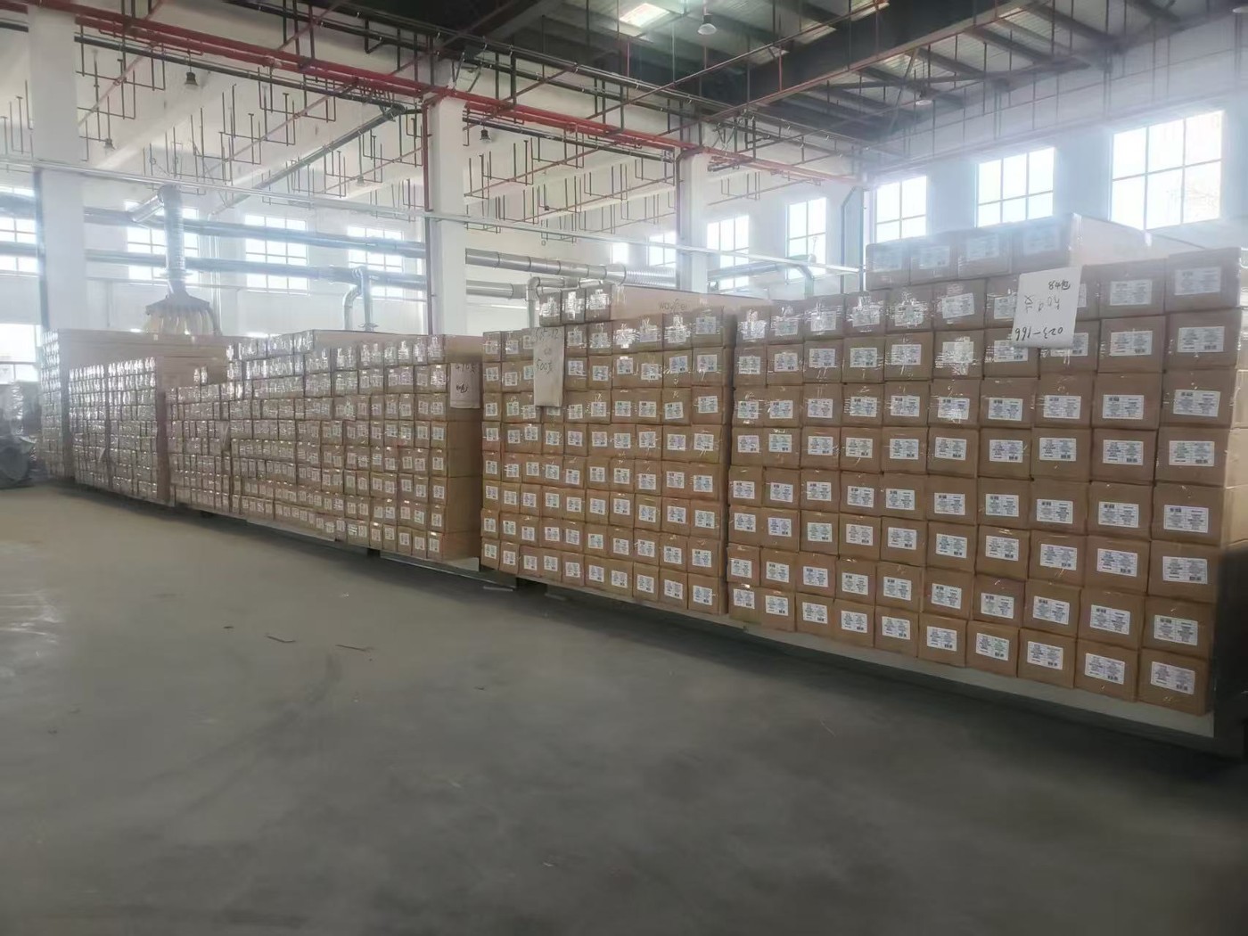 Wall panel cartons stacked on pallets in the warehouse