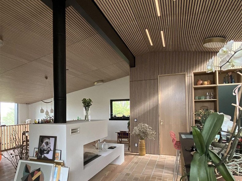 Acoustic panel surfaces in an open interior